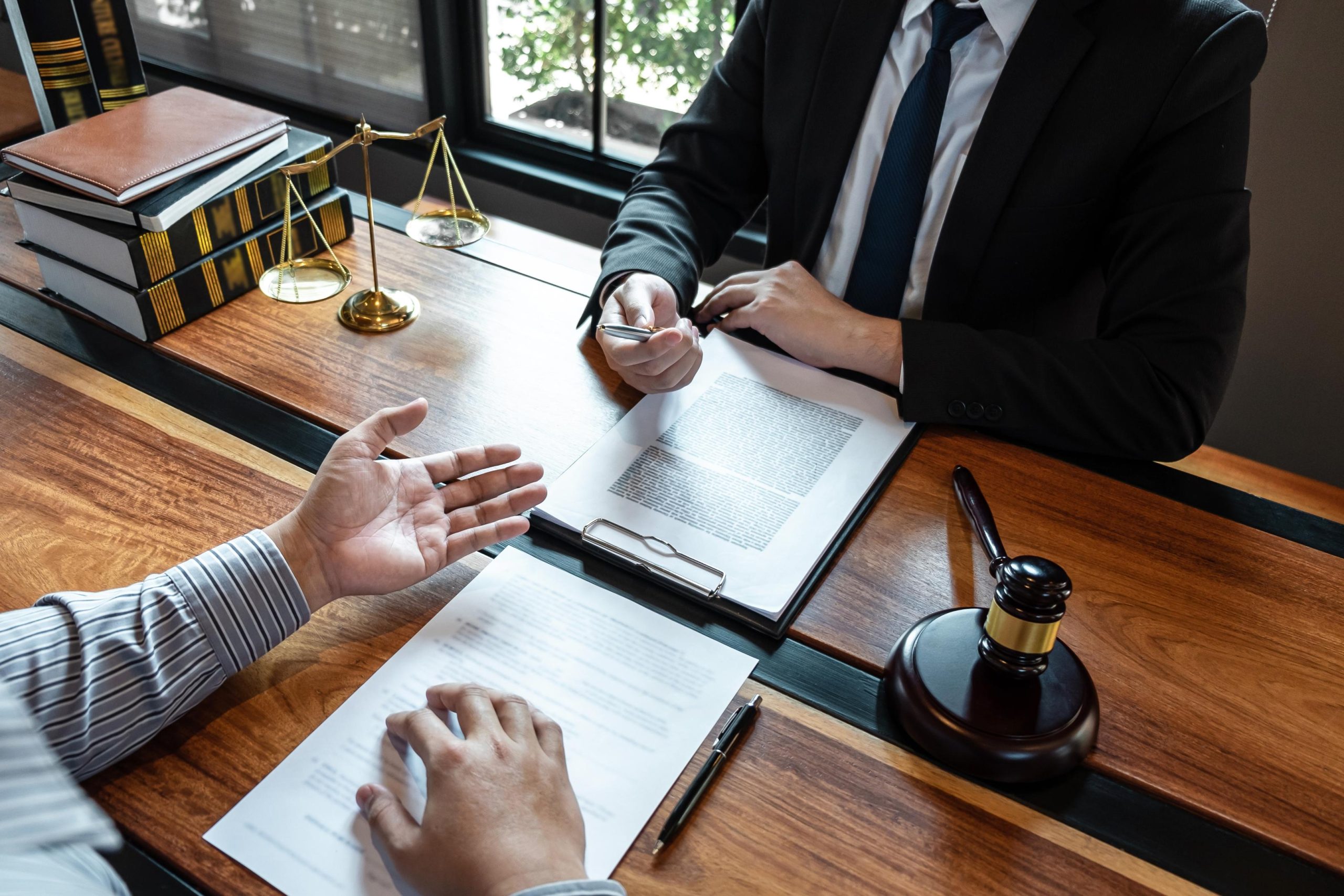 Professional male lawyer or counselor discussing negotiation leg