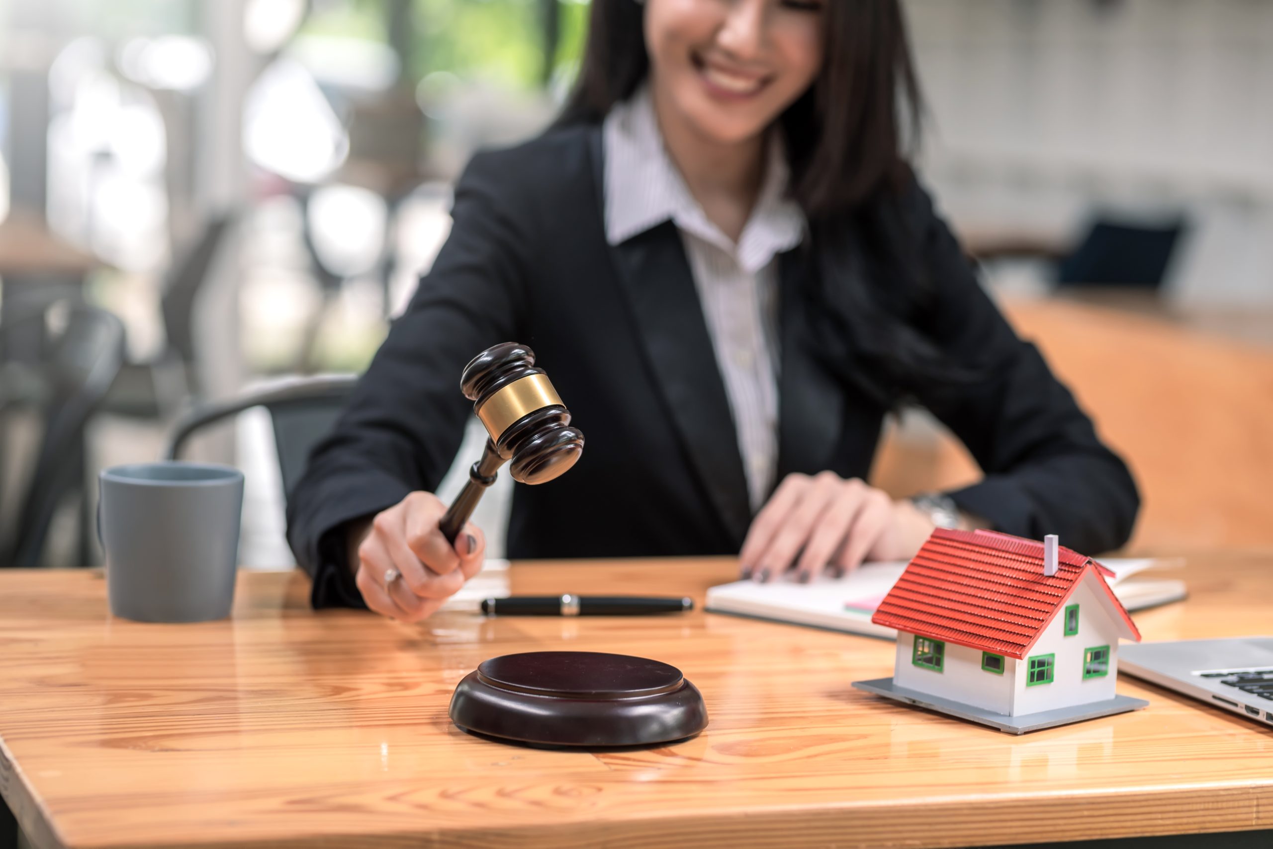 close up of woman lawyer holding mallet