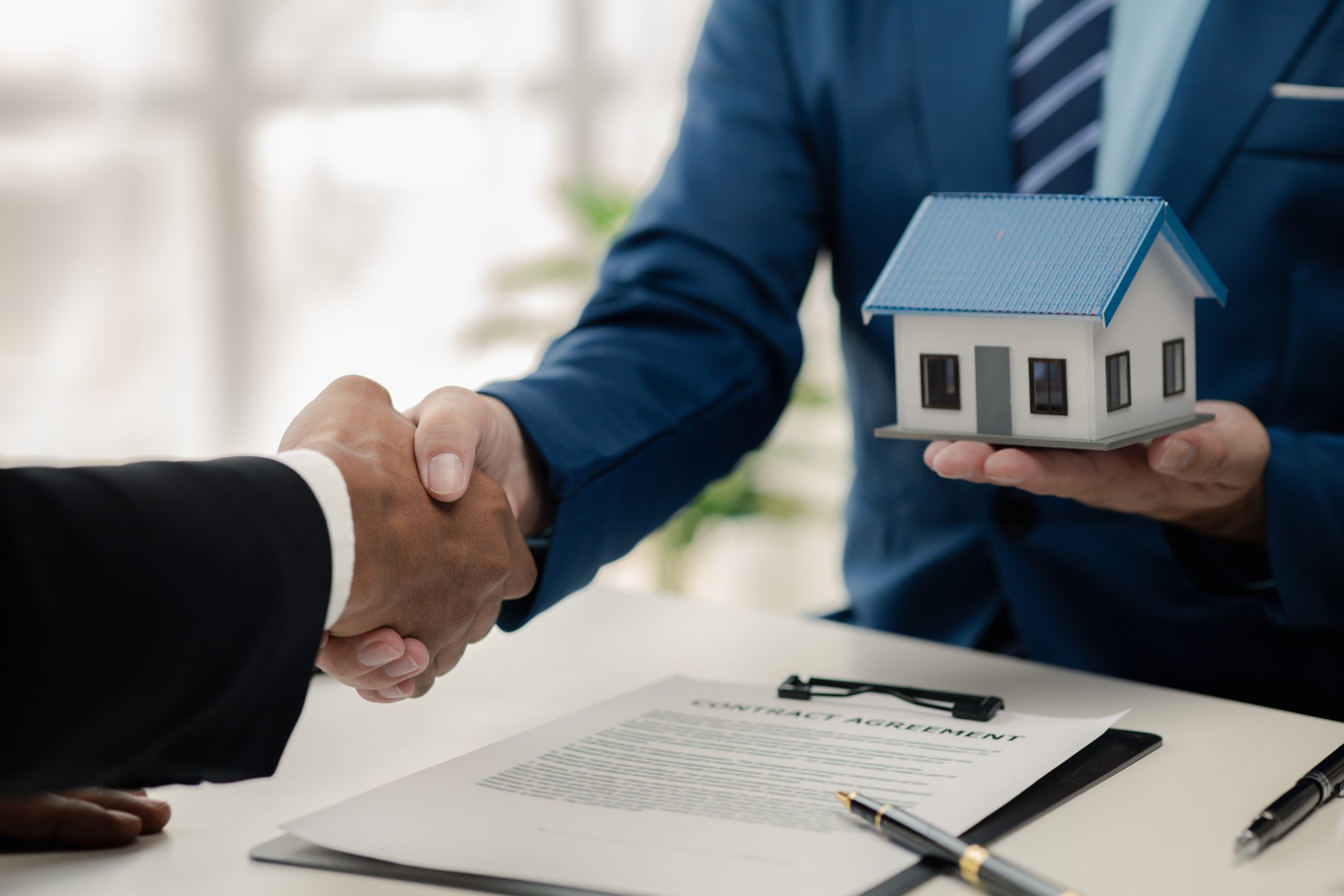 Real estate agents explain models of housing estates in projects