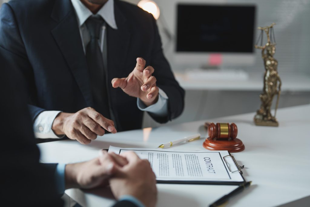 Lawyer explaining contract details to client in office meeting