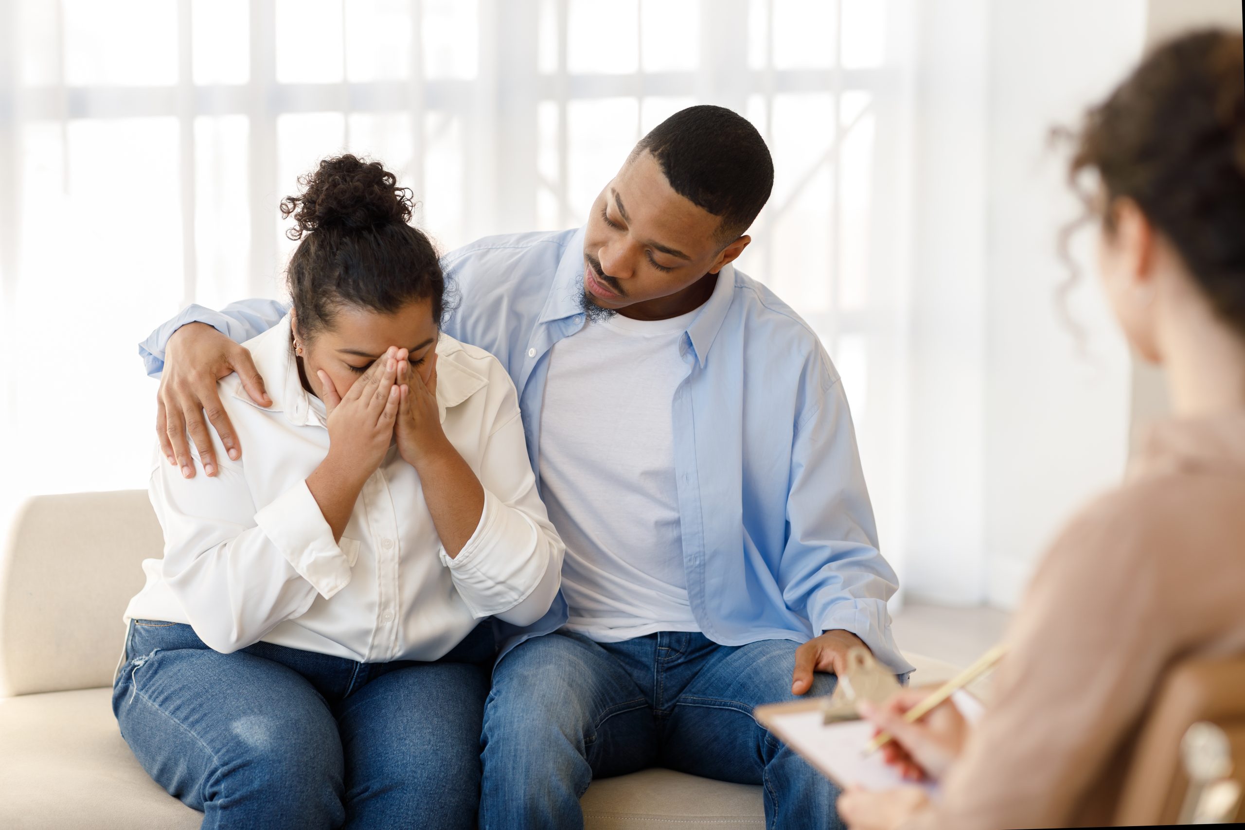 Loving black man comforting crying girlfriend, attend family therapy