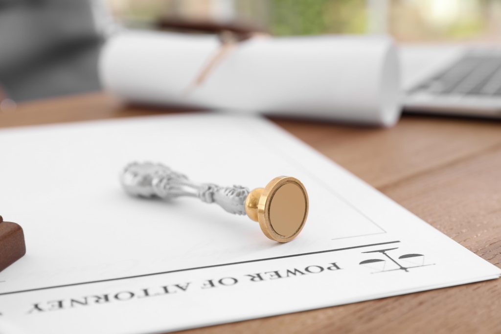 Vintage notary stamp and document on desk, closeup