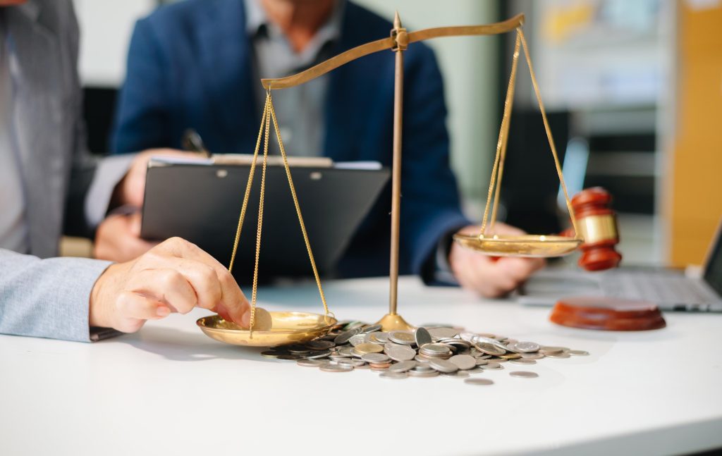 Scales of Justice with Gavel and Coins